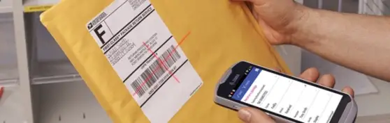 Man scanning an envelope using a cell phone